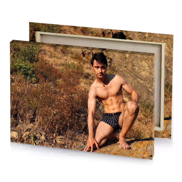 a man in black and white underwear sitting on rock bistre canvas
