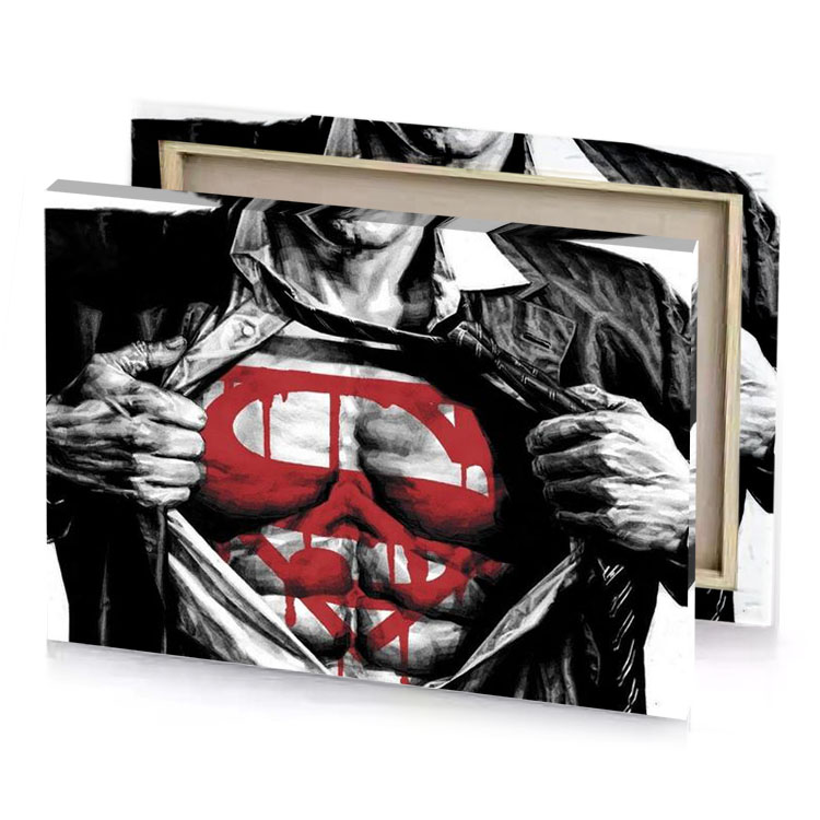 a man in black leather jacket holding red superman shirt garnet canvas