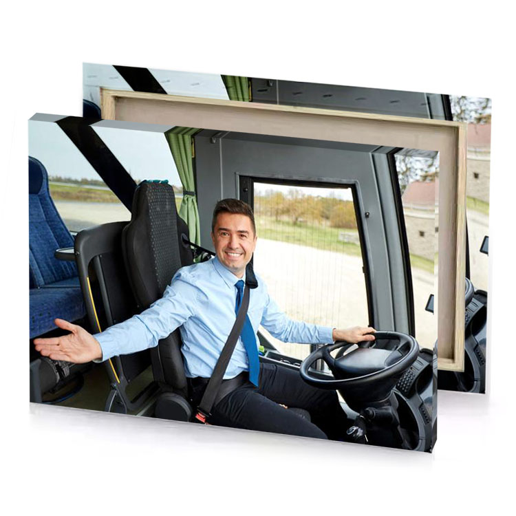 a man in blue shirt and tie sitting truck smoky black canvas
