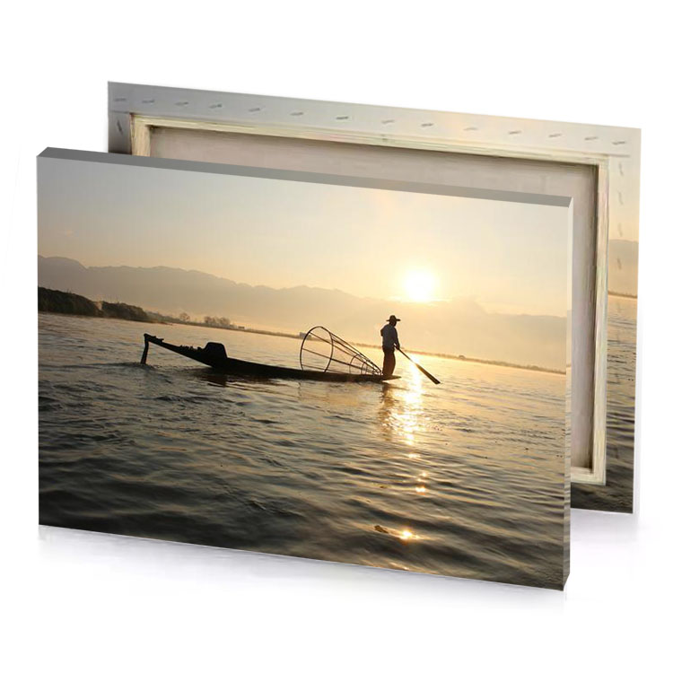 a man in boat on lake burlywood canvas