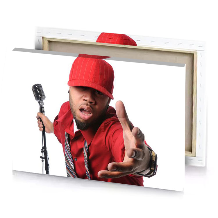 a man in red shirt and tie holding microphone white canvas