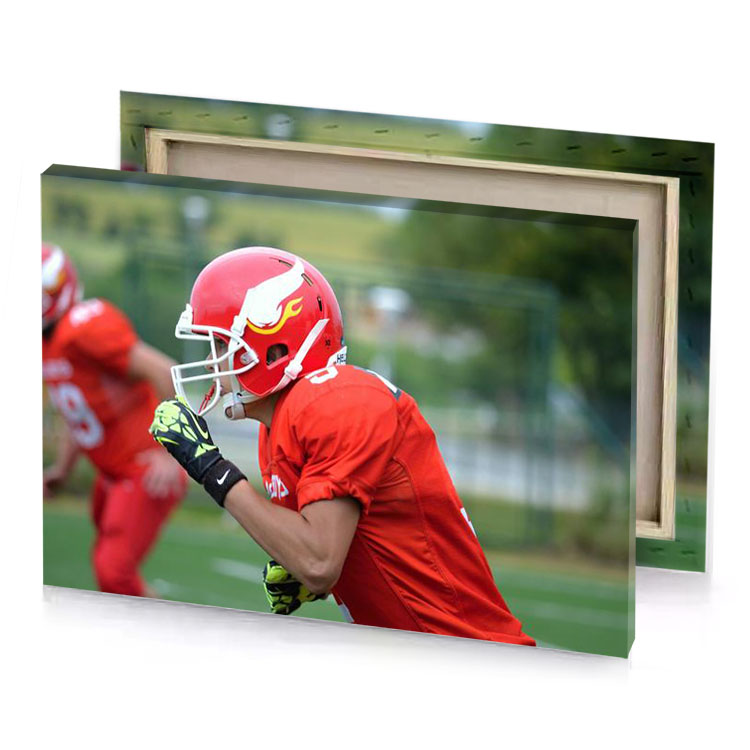 a man in red uniform holding football lust canvas