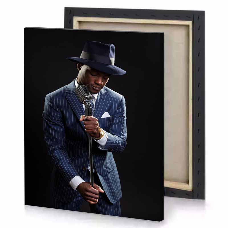 a man in suit and hat is holding microphone smoky black canvas