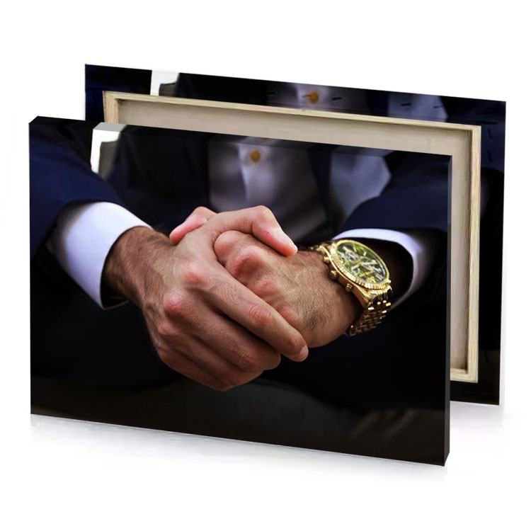 a man in suit and tie holding watch rosy brown canvas