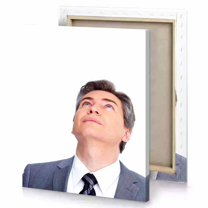 a man in suit and tie looking up white canvas