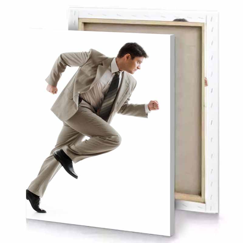 a man in suit and tie running white canvas