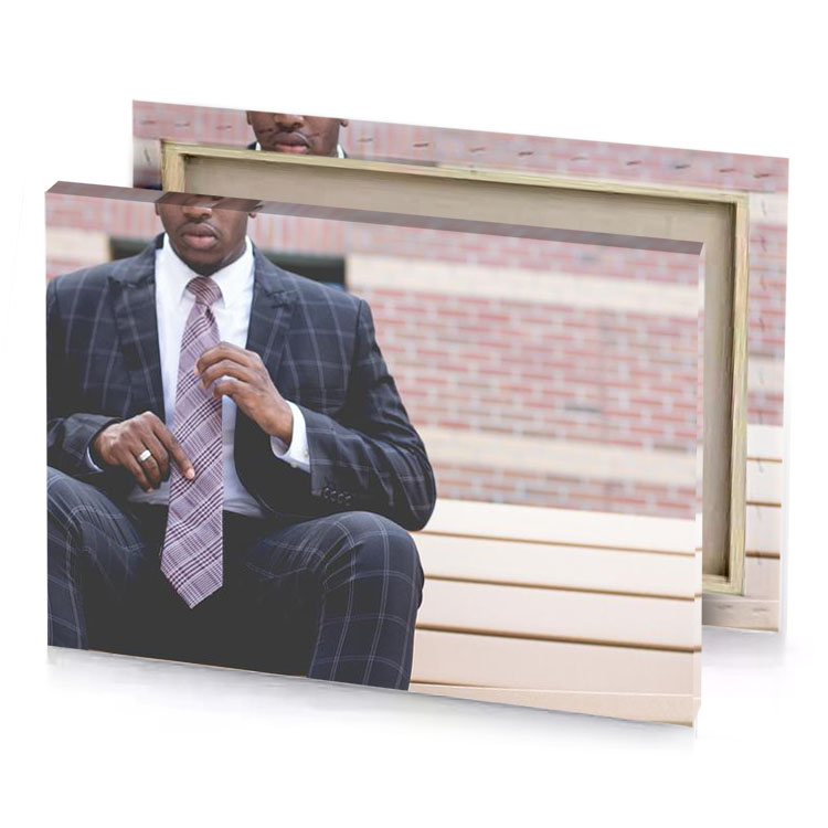 a man in suit and tie sitting on bench charcoal canvas