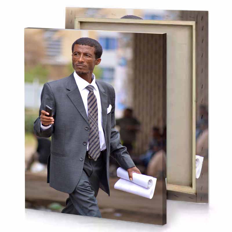 a man in suit and tie walking down street dim gray canvas