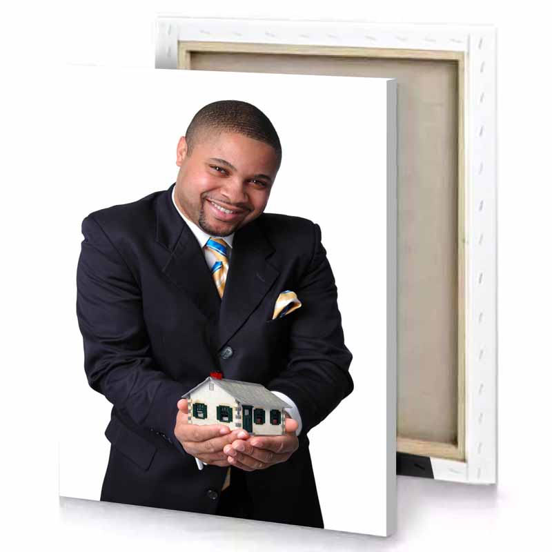a man in suit holding model of house smoky black canvas