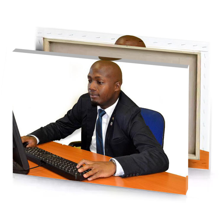a man in suit sitting at desk with computer white canvas