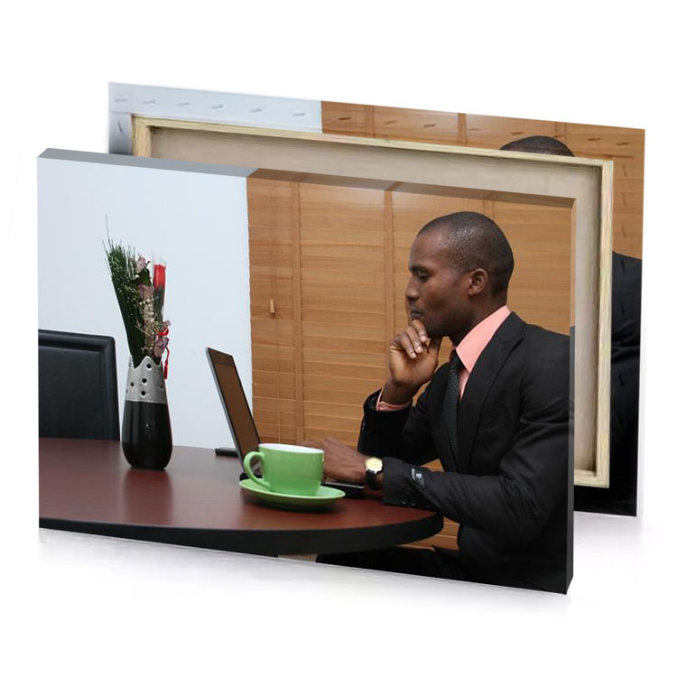 a man in suit sitting at table with laptop platinum canvas