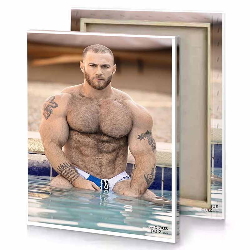 a man in swimming suit sitting on the edge of snow canvas
