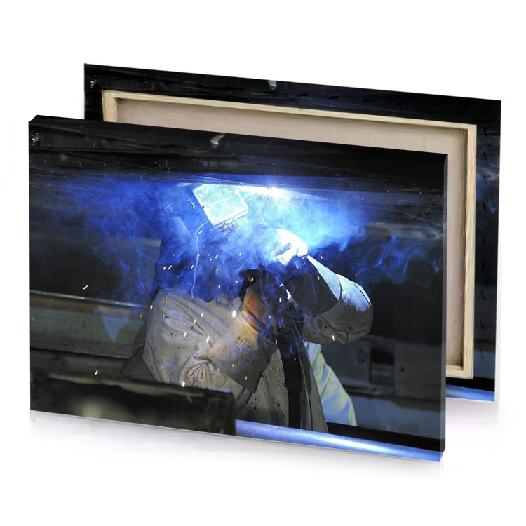 a man in white coat is welding royal blue canvas