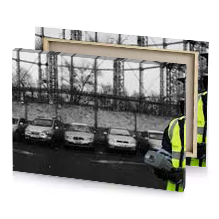 a man in yellow vest and gray canvas