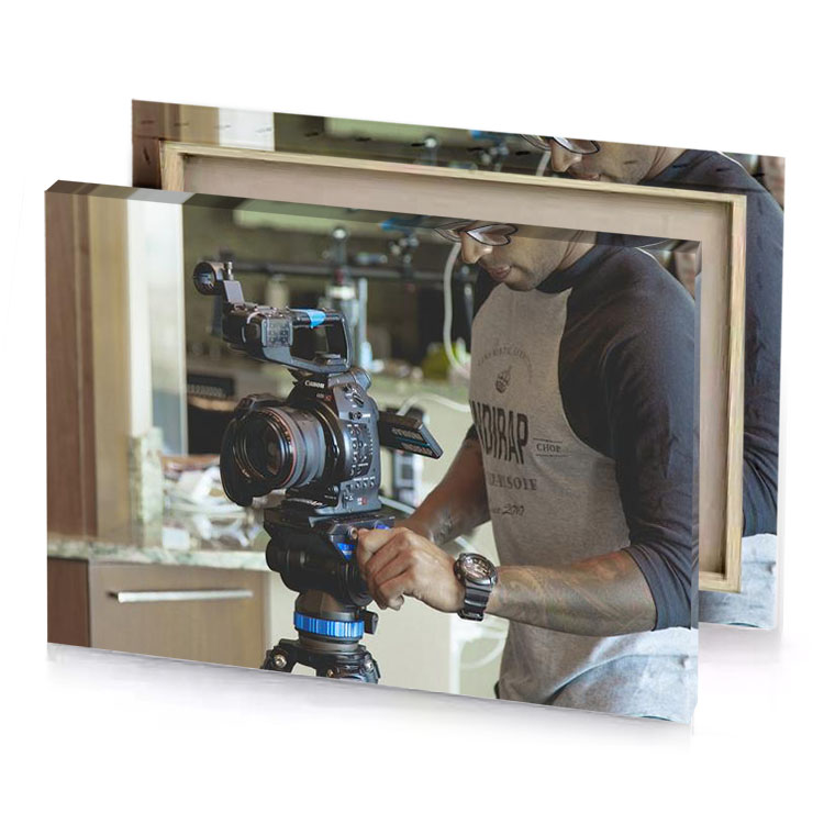 a man is holding camera and taking picture dim gray canvas