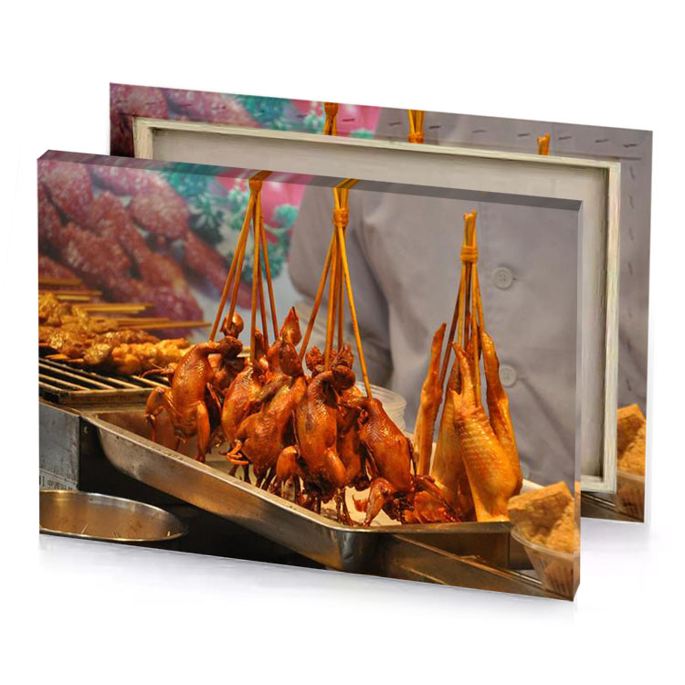 a man is standing behind tray of food maroon canvas