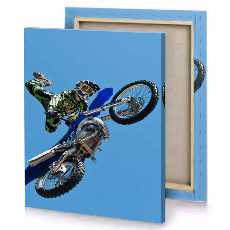 a man on motorcycle doing trick zaffre canvas