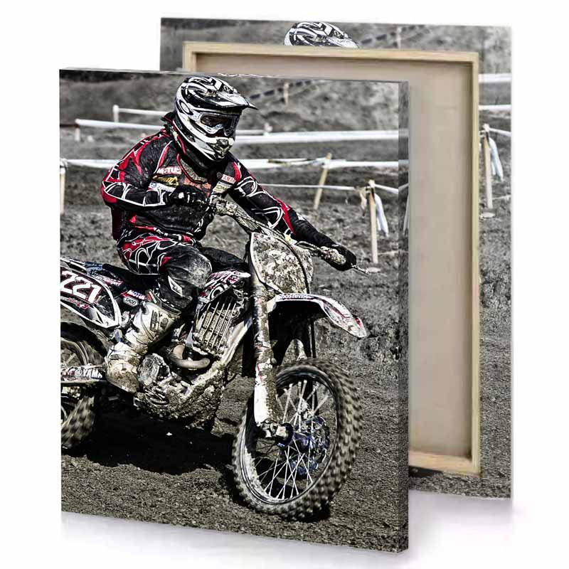 a man riding dirt bike on track smoky black canvas