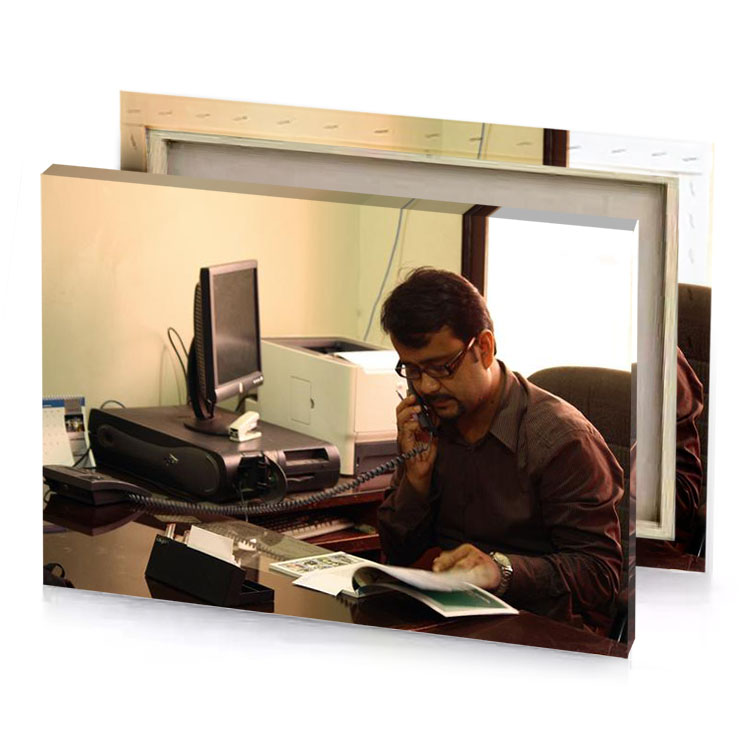 a man sitting at desk talking on cell smoky black canvas