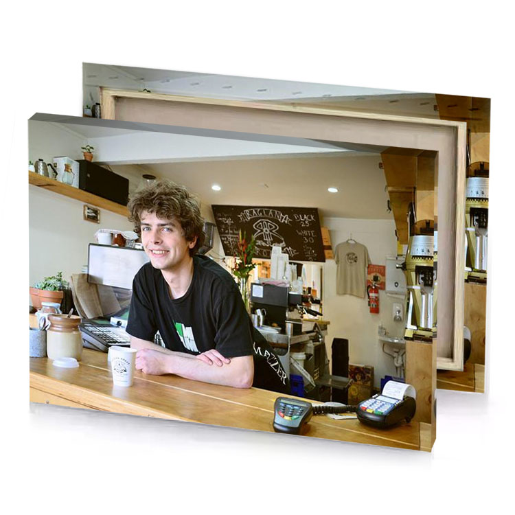 a man sitting at desk with laptop rosy brown canvas