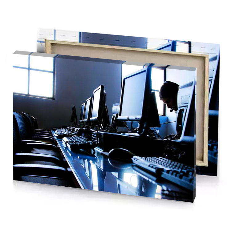 a man sitting at desk with multiple computer monitors dark slate blue canvas