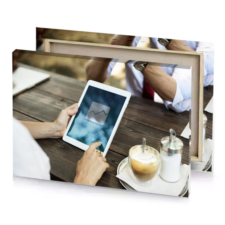 a man sitting at table using tablet prussian blue canvas