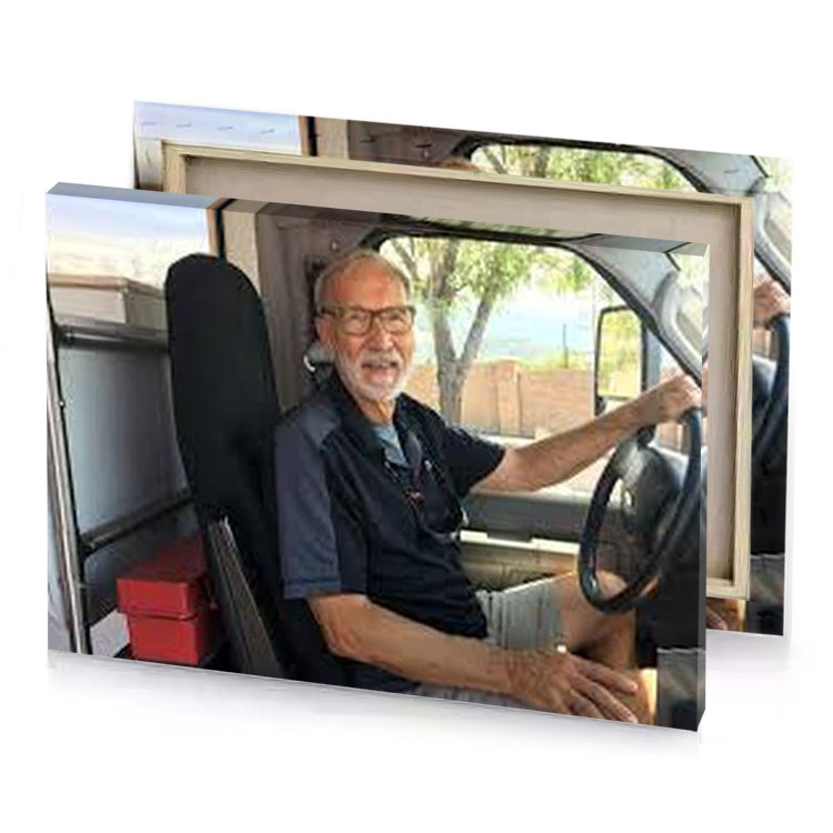 a man sitting in van smoky black canvas