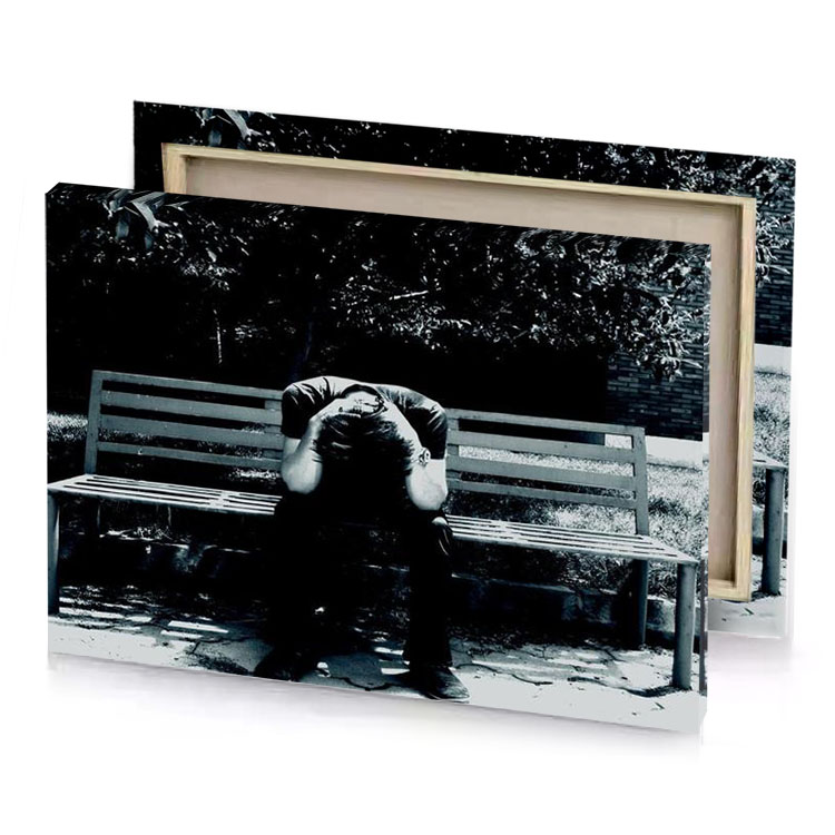 a man sitting on bench in the shade smoky black canvas