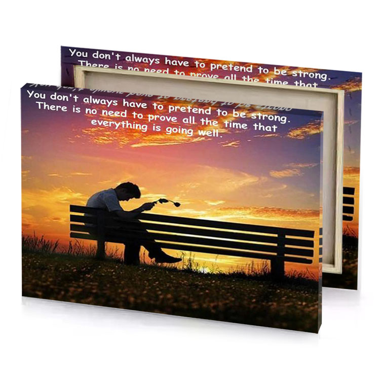 a man sitting on bench with the sun setting behind smoky black canvas