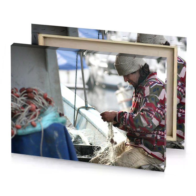 a man sitting on boat gray canvas
