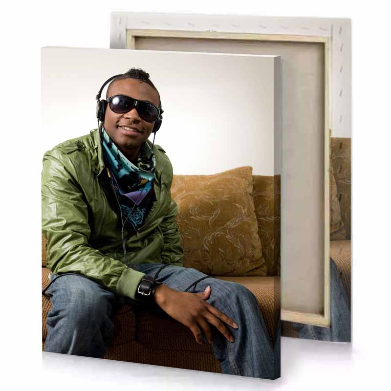 a man sitting on couch wearing headphones linen canvas