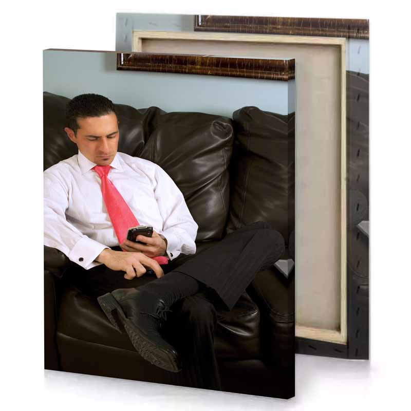 a man sitting on couch with cell in his hand smoky black canvas