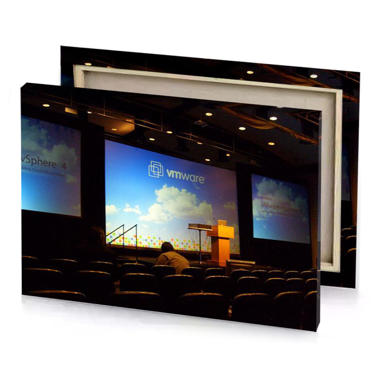 a man standing in front of stage with projector blue jeans canvas