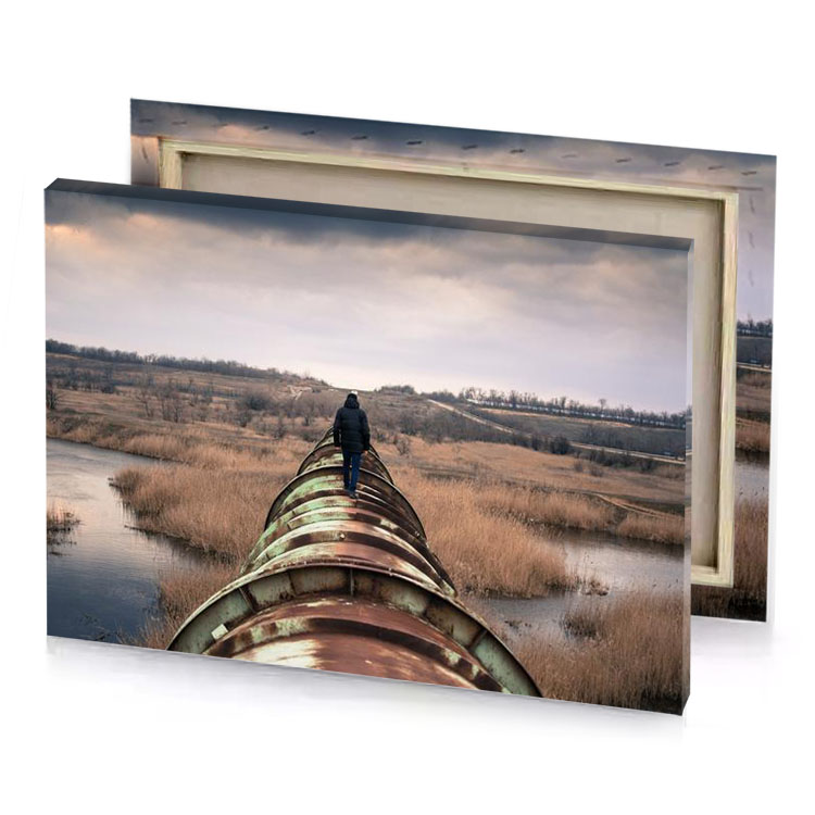 a man standing on rusty pipe in field camouflage green canvas