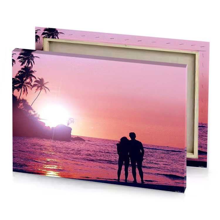 a man standing on the beach looking at sunset light coral canvas