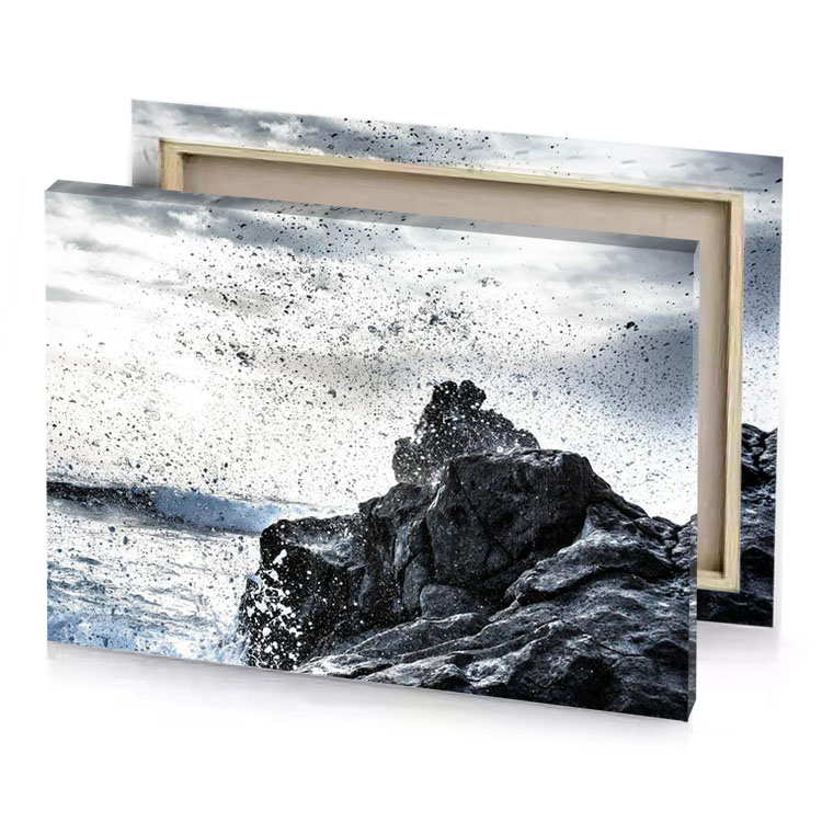 a man standing on top of rock near the ocean white smoke canvas