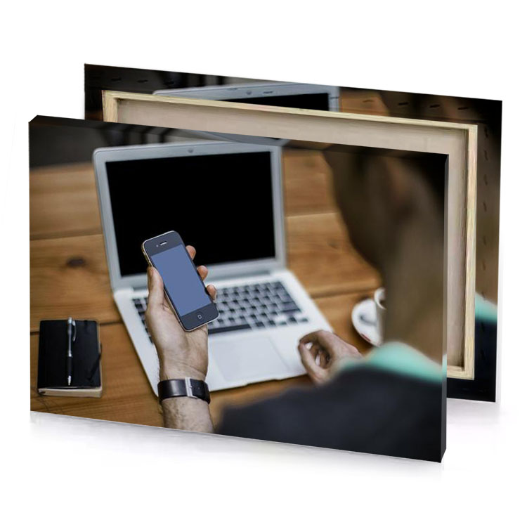 a man using cell phone on laptop slate gray canvas