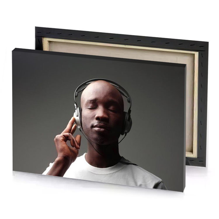 a man wearing headphones while talking on cell charcoal canvas