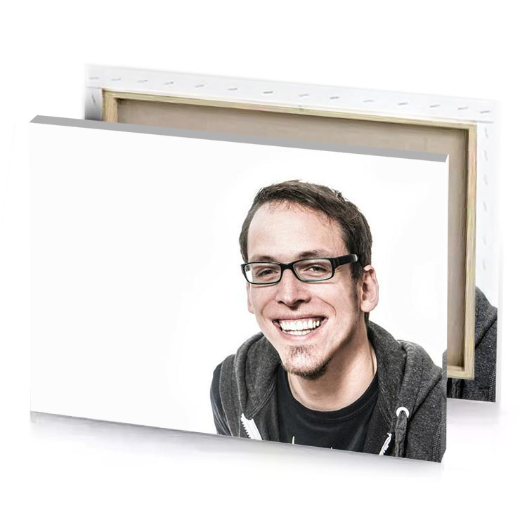 a man with glasses and hoodie smiling snow canvas