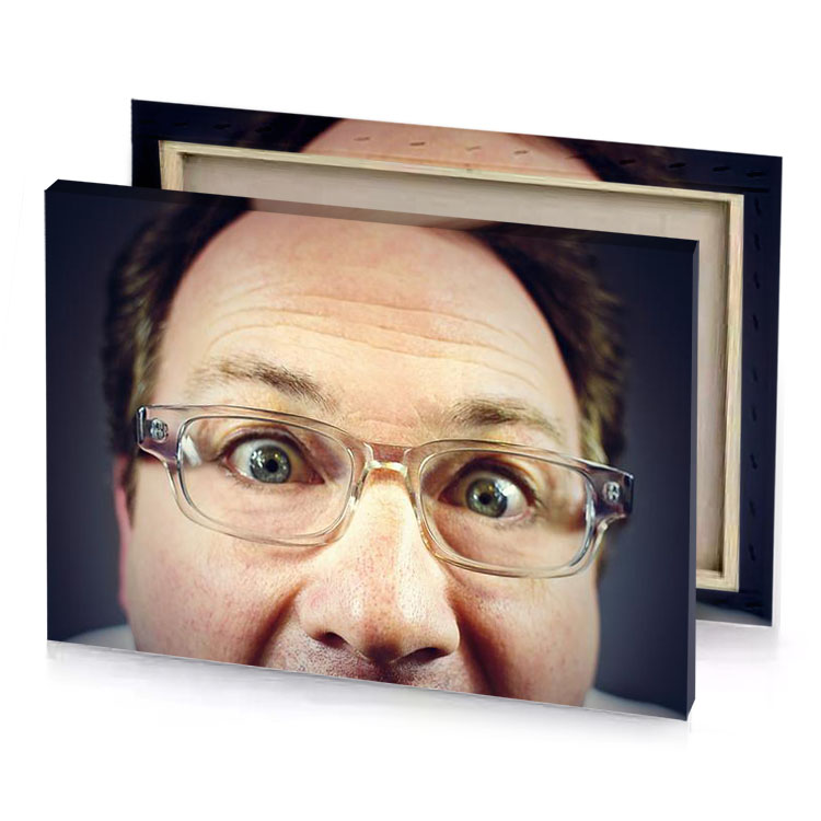 a man with glasses and tie on peach puff canvas