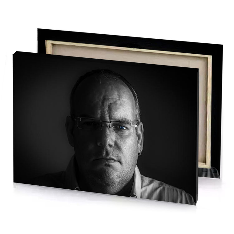 a man with glasses and tie smoky black canvas
