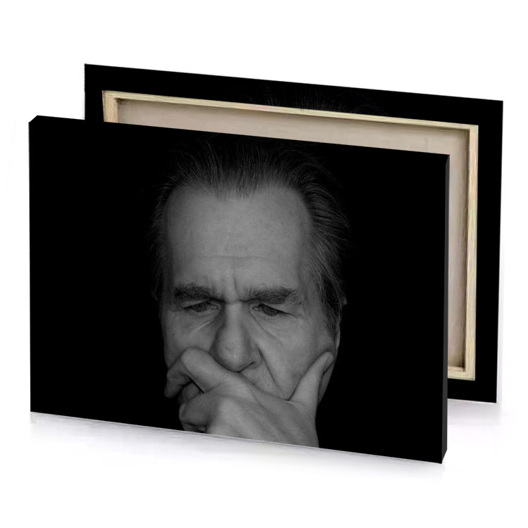 a man with his hand on face black canvas