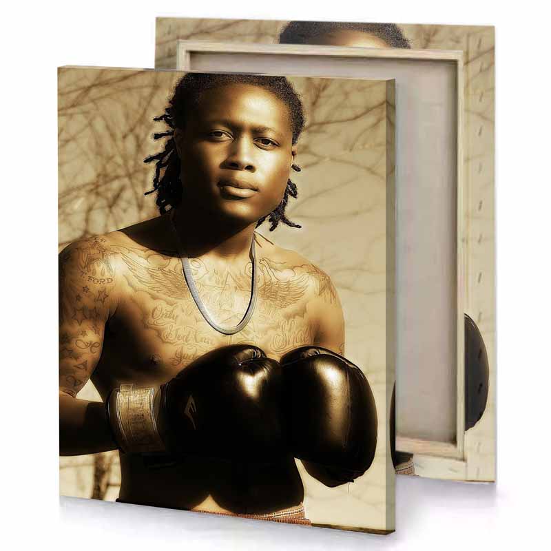 a man with tattoos and boxing glove tan canvas