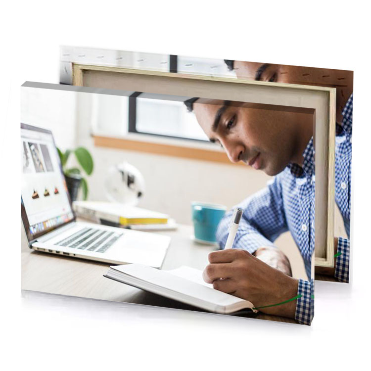 a man writing on notebook while sitting at desk platinum canvas