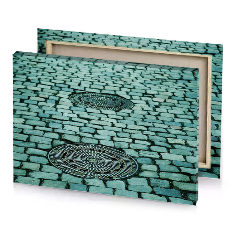 a manhole on cobbled street dark gray canvas