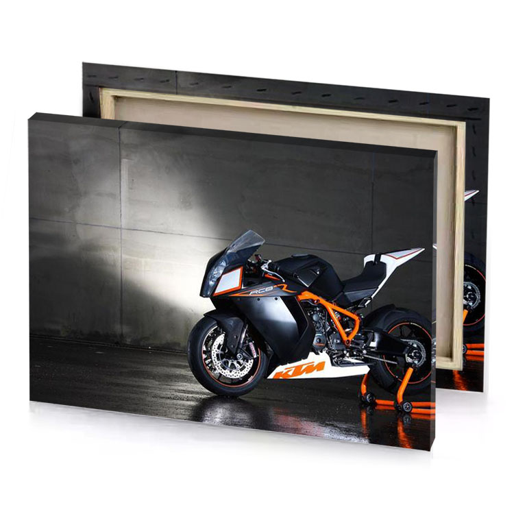 a motorcycle parked in garage with light shining on the linen canvas