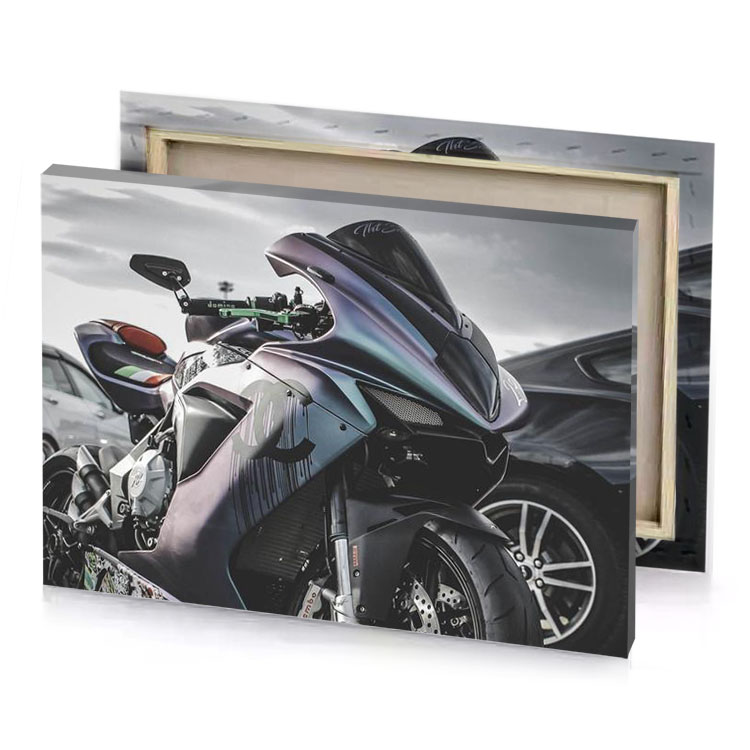 a motorcycle parked in parking lot next to car taupe canvas