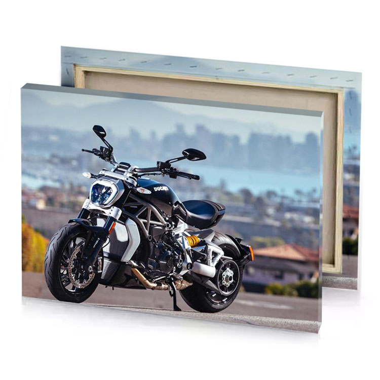 a motorcycle parked on road next to city smoky black canvas