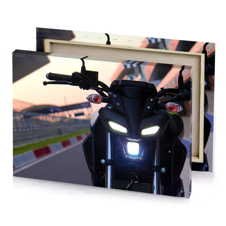 a motorcycle parked on street with light smoky black canvas