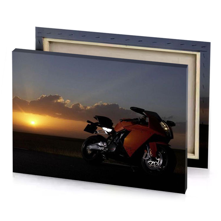 a motorcycle parked on the side of road at sunset garnet canvas
